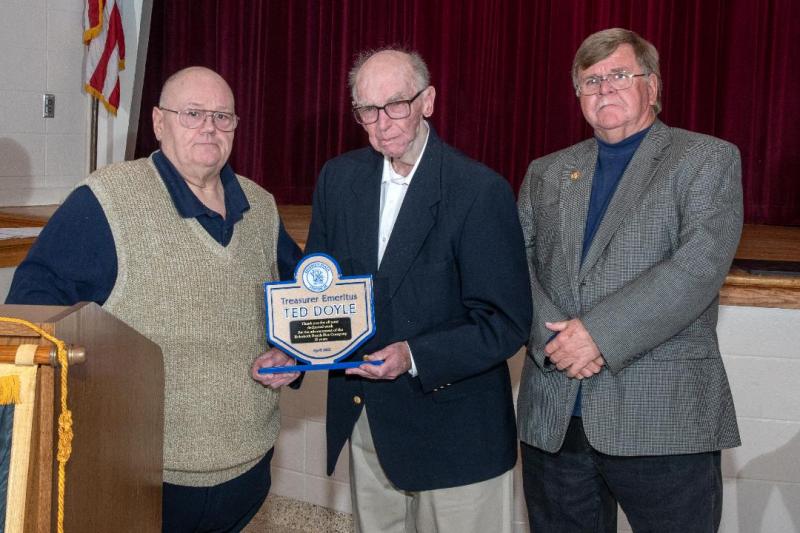 Past Treasurer Ted Doyle is honored with the title of treasurer emeritus. Shown are (l-r) President Danny Mitchell, Ted Doyle and Chief Chuck Snyder.